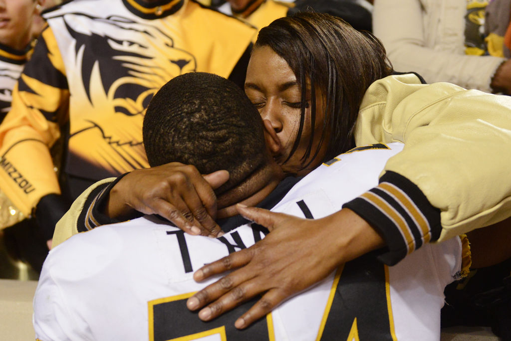 Felicia Hall kisses her son Terez Hall on the cheek